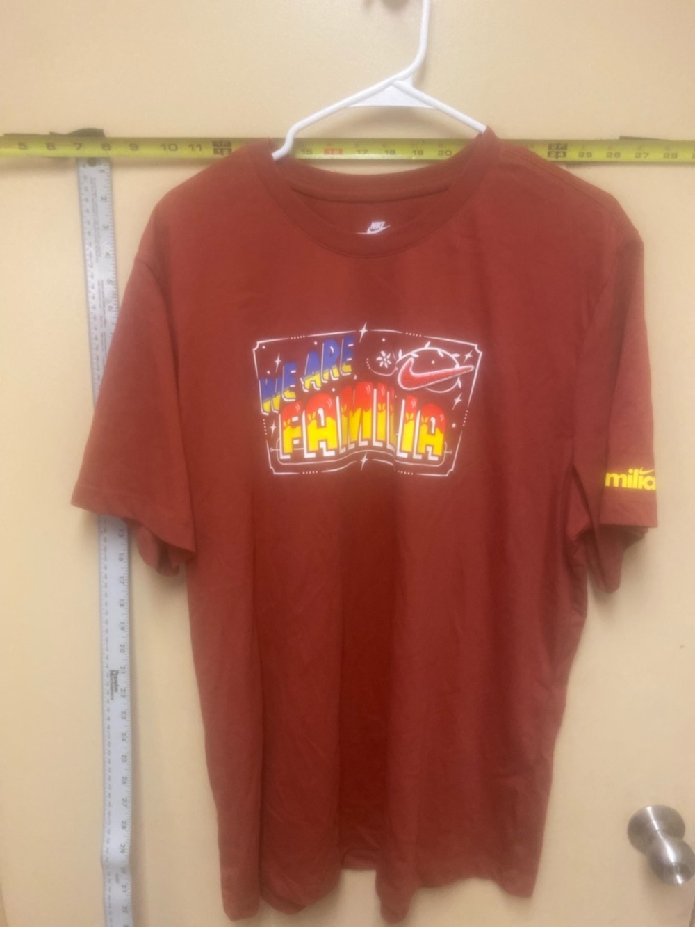 Nike Rust Graphic 'We Are Familia' Short Sleeve Tee nwt